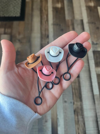 Cowboy hat straw toppers in various colors: white, pink, brown, and black