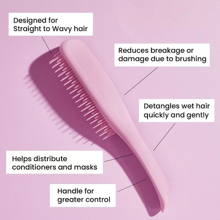 A pink hairbrush ideal for straight to wavy hair, designed to minimize breakage, detangle wet hair, and evenly distribute conditioners and hair masks, with a handle for better control