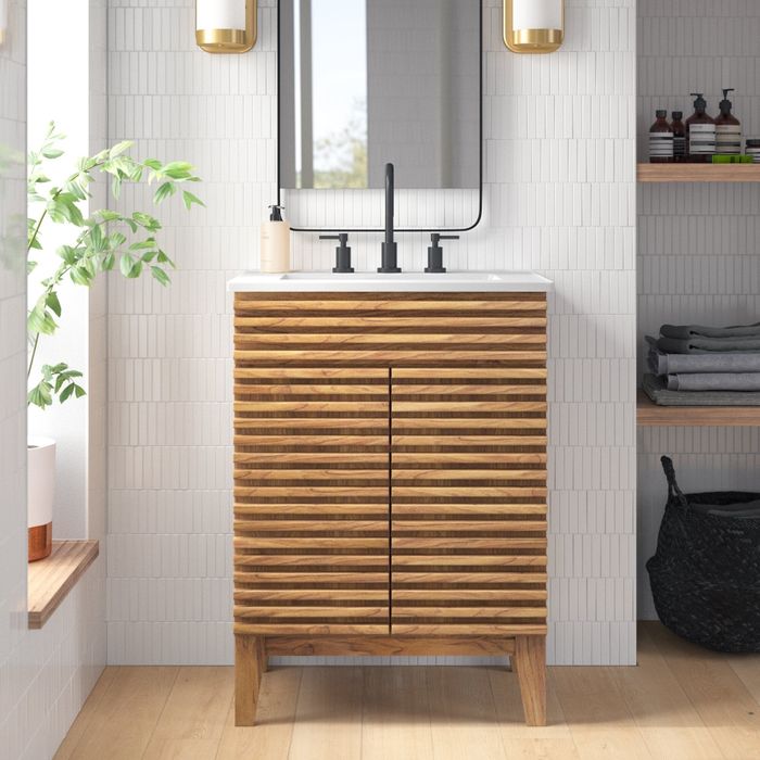 A wooden vanity cabinet for the bathroom, featuring an integrated sink