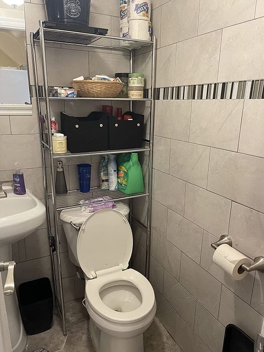 Photo from a reviewer displaying an over-toilet storage shelf in use