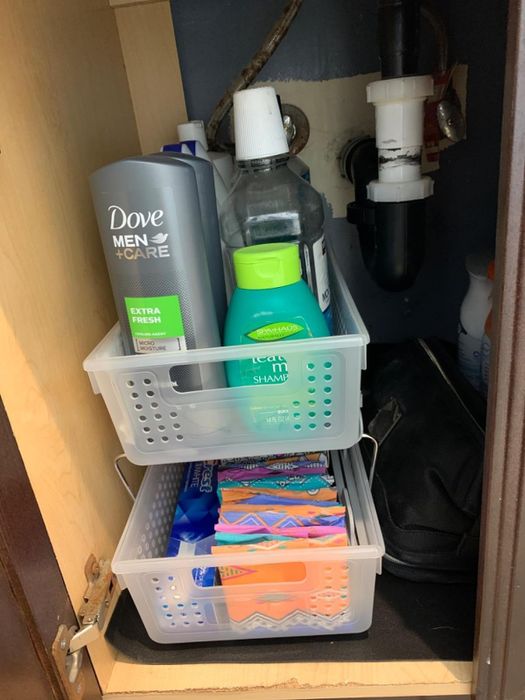 A reviewer’s image showcasing the baskets neatly arranged in a bathroom, filled with various toiletries.