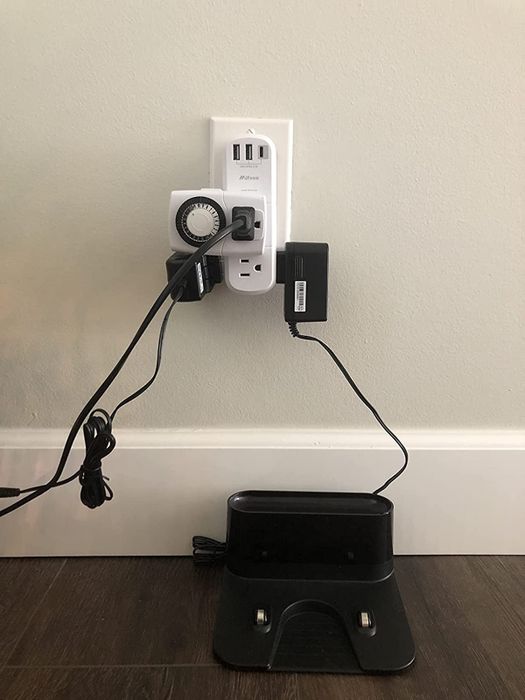 A before photo showing a reviewer's outlet overcrowded with multiple items plugged in.