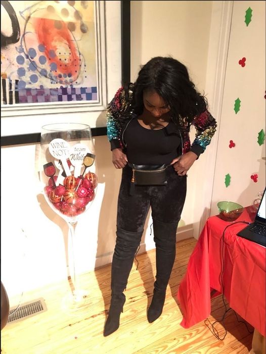 A reviewer showcasing black velvet leggings.