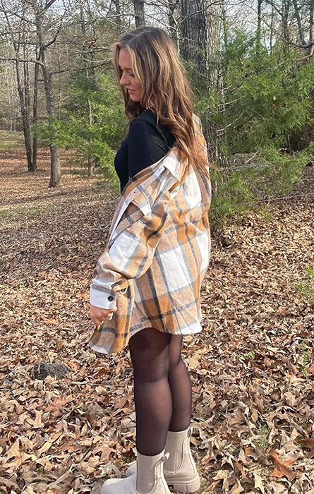 A reviewer wearing a plaid shacket.