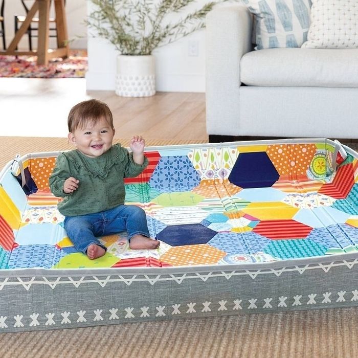 Baby enjoys time in a play yard