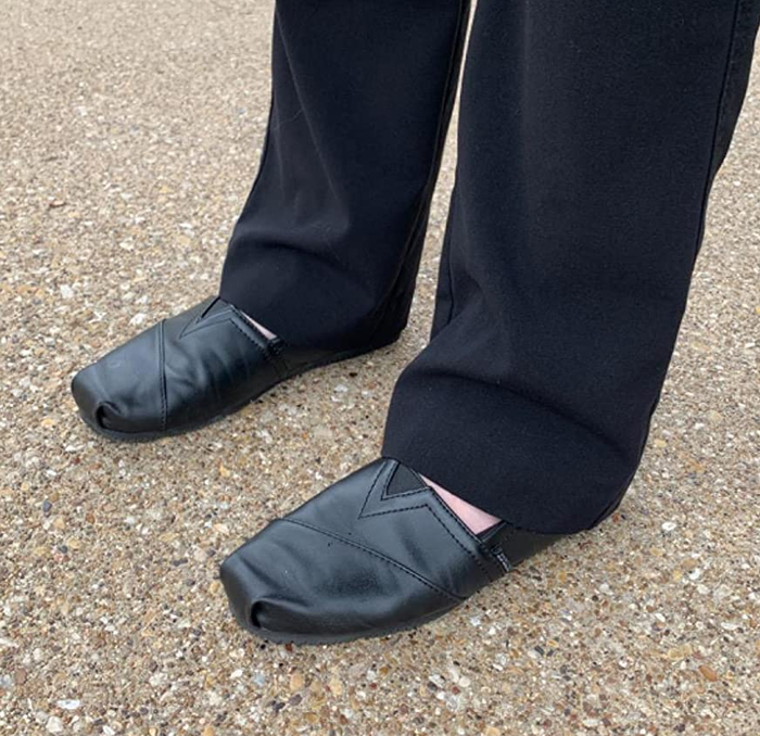 Image of a reviewer wearing black shoes