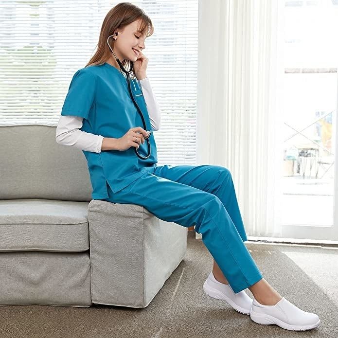 Nurse relaxing, practicing with a stethoscope while wearing white shoes