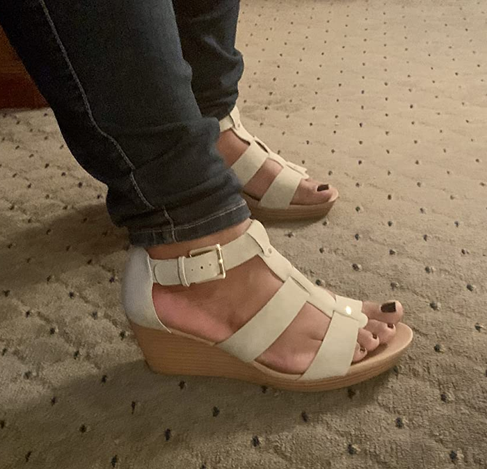 A reviewer wearing off-white sandals