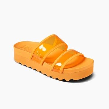 An orange platform sandal featuring two straps and a chunky sole