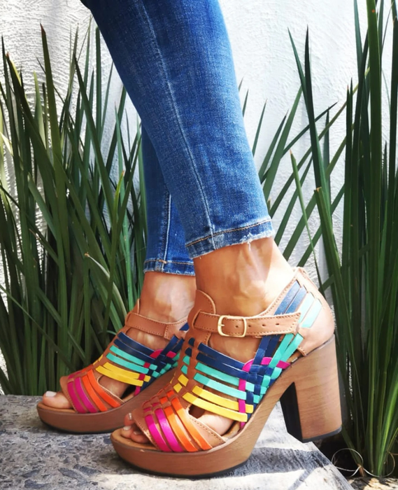 A model wearing multicolored platform sandals