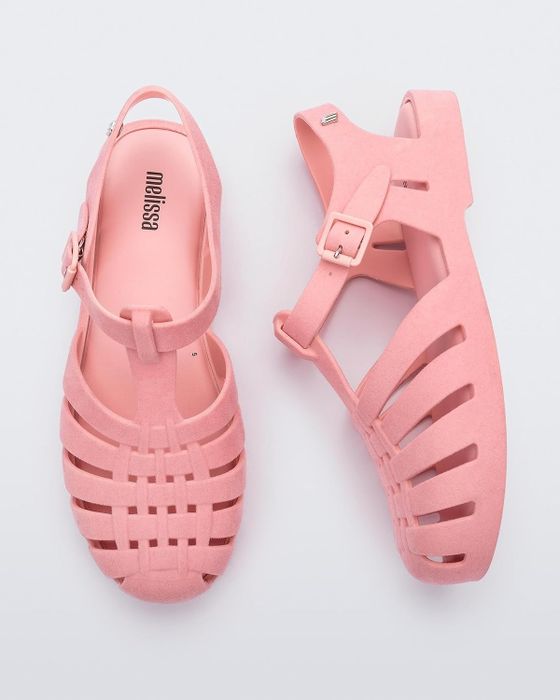 A pair of pink jelly fisherman sandals