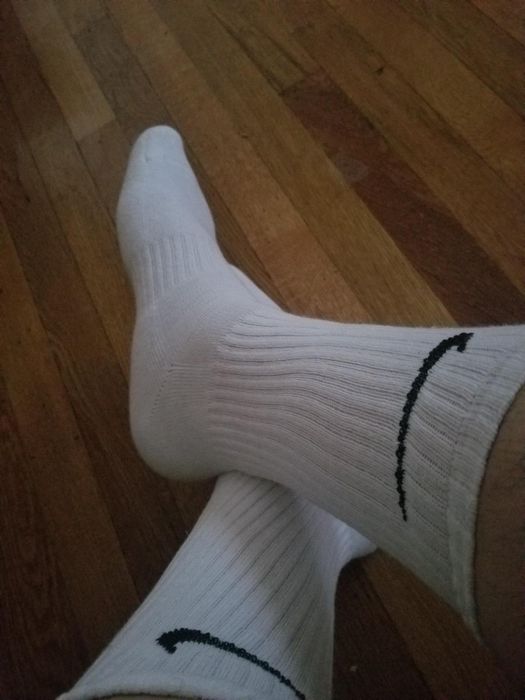 A reviewer wearing Nike socks.
