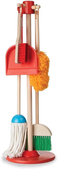 A broom, mop, duster, brush, and dustpan hanging neatly on a wooden organizer