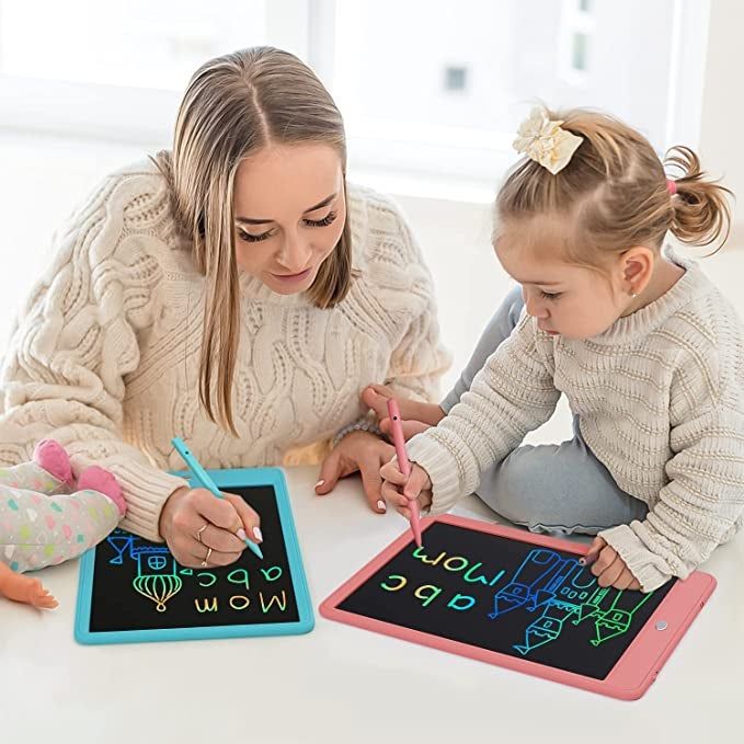 A parent and child sharing a creative moment as they draw on an LCD writing tablet.