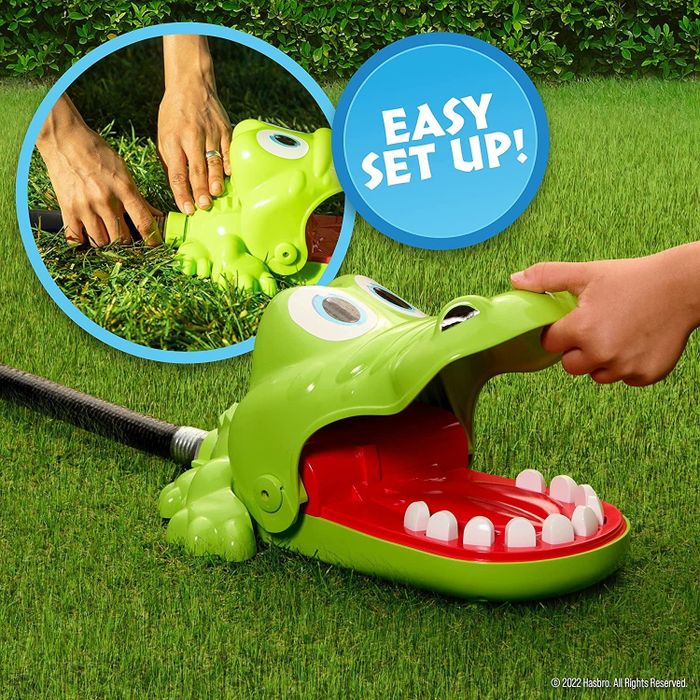 Close-up shot of the crocodile sprayer with its mouth open, hose attached