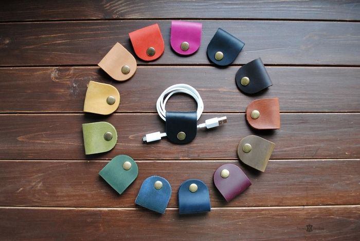 A circular arrangement of multicolored leather cord organizers.
