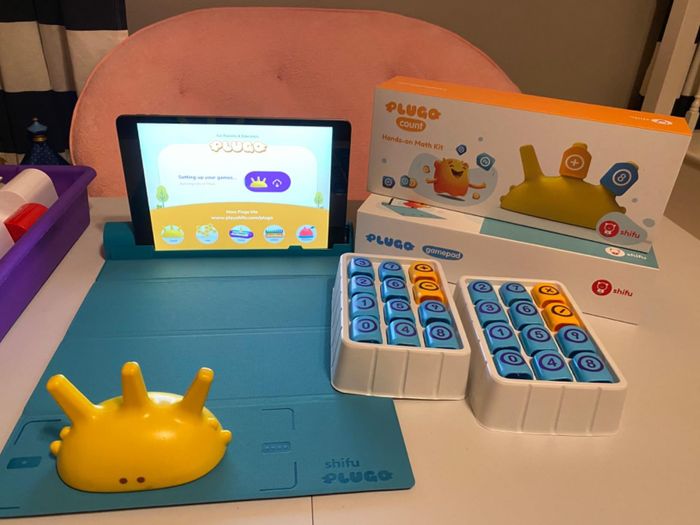 A game featuring a play mat and an assortment of pieces for interactive fun.
