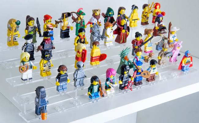 A stand showcasing a variety of Lego figures in display.