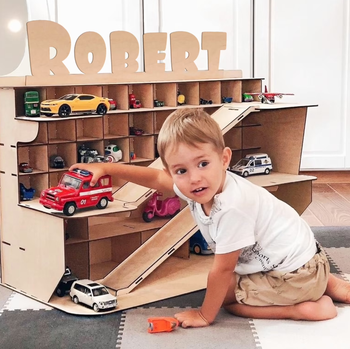 A child having fun while playing with cars.