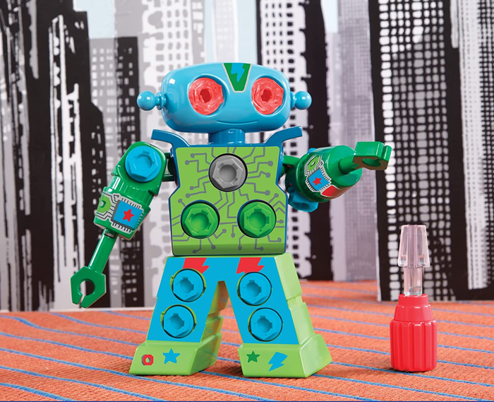 A green and blue plastic robot toy with red eyes