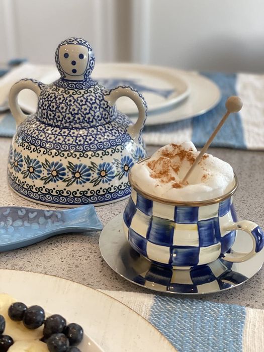A reviewer's photo of a mug topped with perfectly foamed milk.