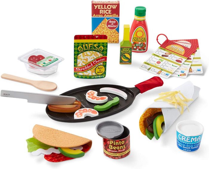 A complete set of felt and plastic food items, including toy ingredients and cooking tools
