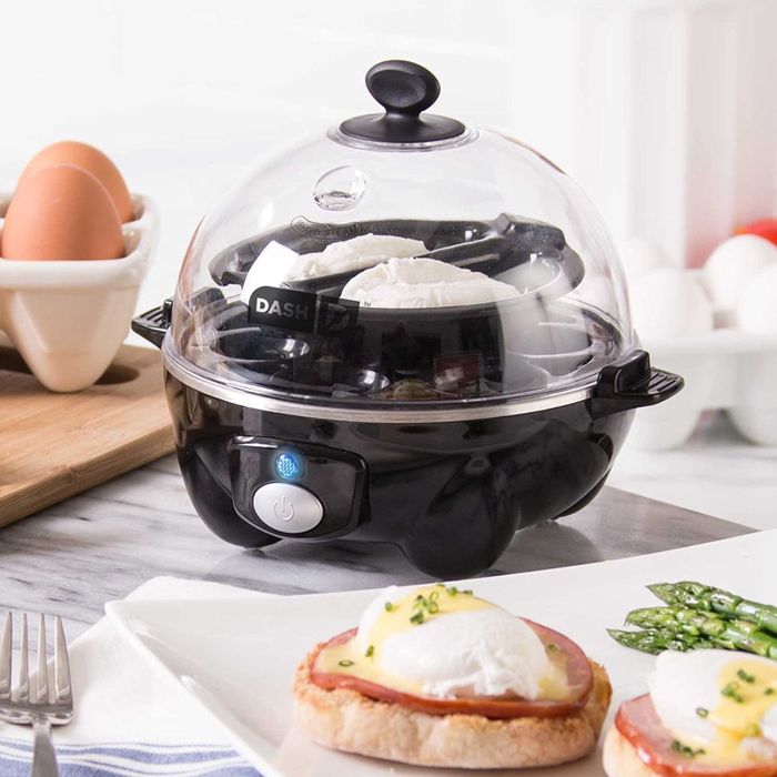 A product photo displaying the egg cooker in action, preparing poached eggs.
