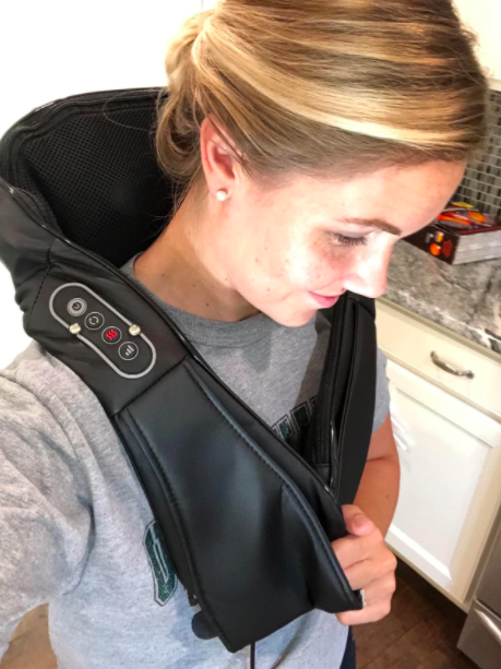 A photo from the reviewer showing how the Naipo Shiatsu massager comfortably rests on the shoulders.