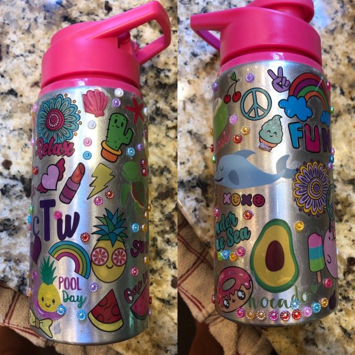Reviewer's image of a water bottle adorned with vibrant stickers