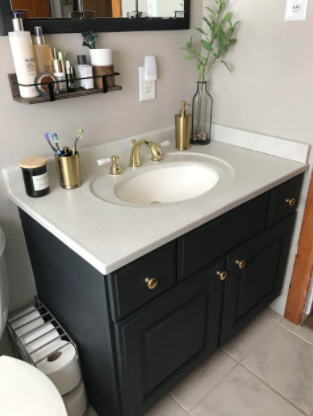 photo showcasing a bathroom vanity transformed using spray paint
