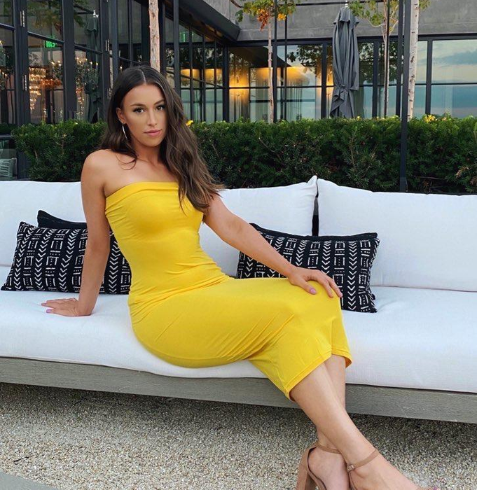 Reviewer showcasing the dress in a vibrant yellow shade