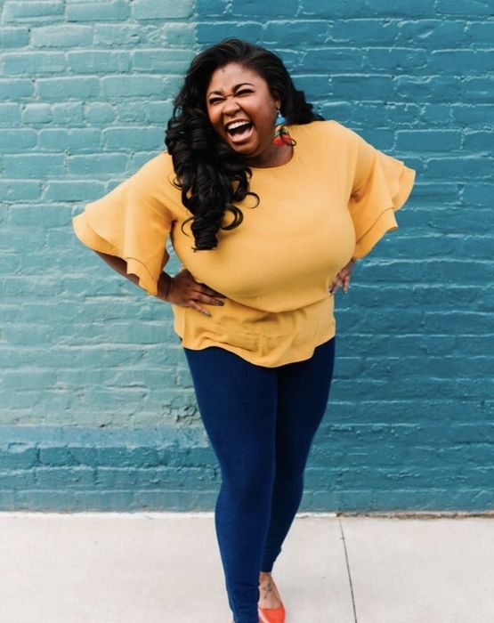 Reviewer photo of someone wearing denim jeans and a yellow blouse.