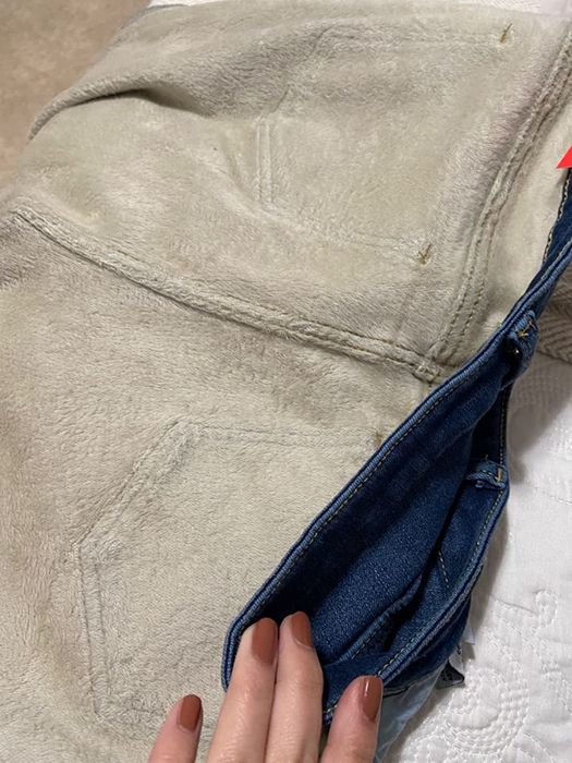 Photo from a reviewer showing fleece-lined jeans inside out