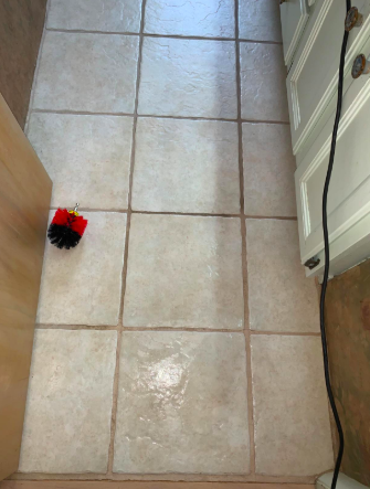 a reviewer’s photo showing the grout cleaning process on a bathroom floor