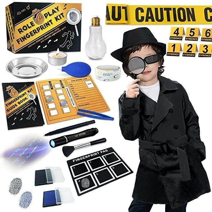 A child dressed in a detective costume, complete with the kit’s full packaging, ready to start their investigation.