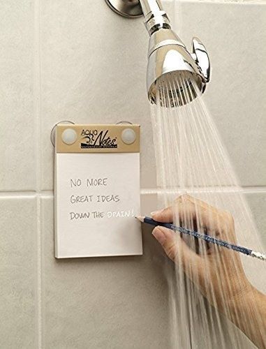 individual writes their latest great idea down on the notepad while in the shower