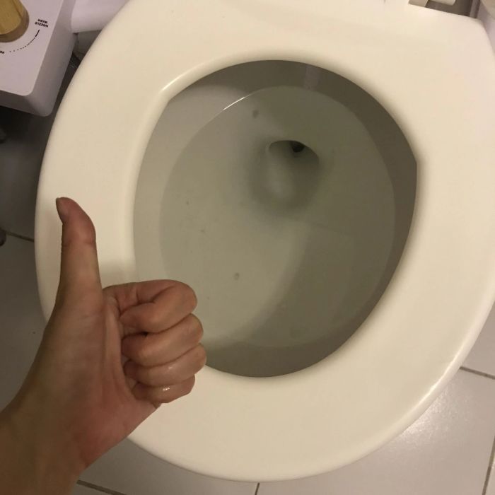 Photo of the same toilet now clean and stain-free