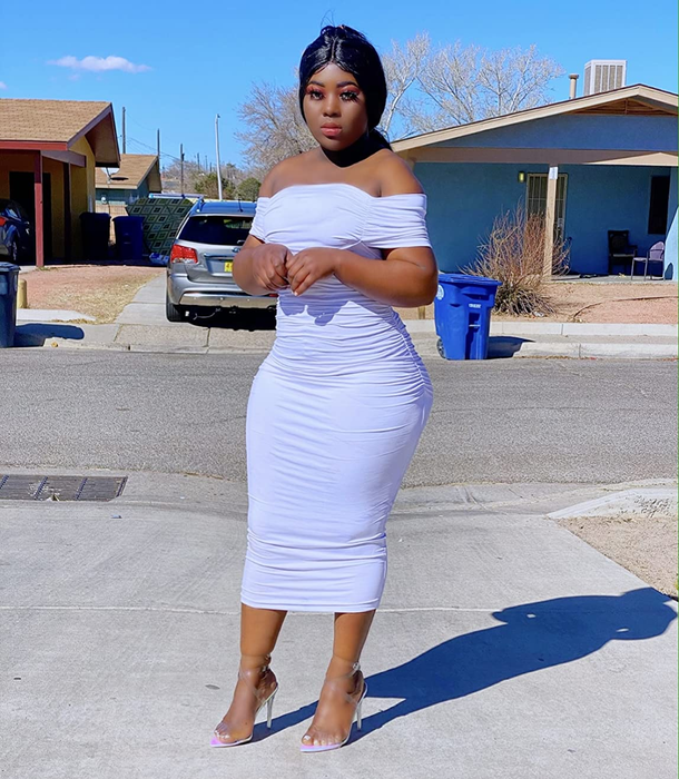 Reviewer in a white dress