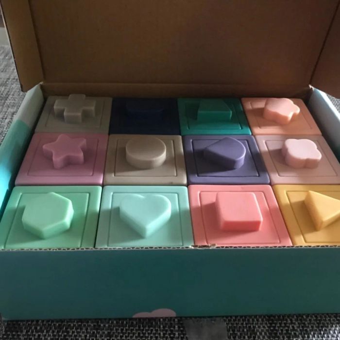 The pastel blocks neatly arranged inside the packaging