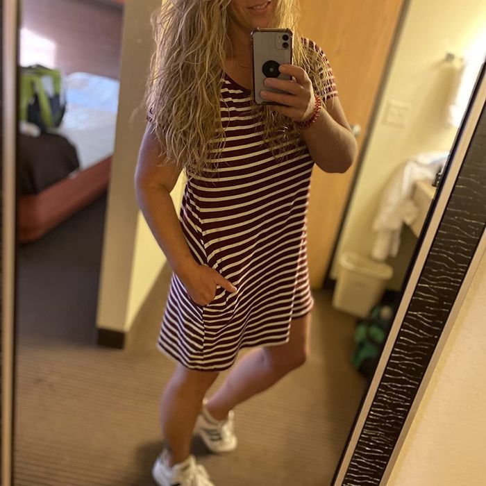 reviewer wearing the striped dress