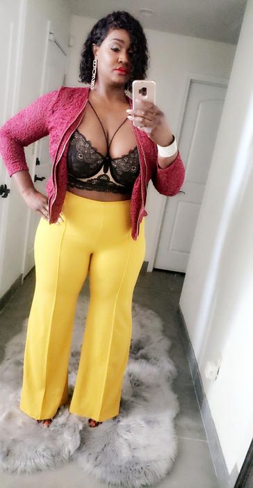 Another reviewer sporting the yellow pants with a lace top and jacket