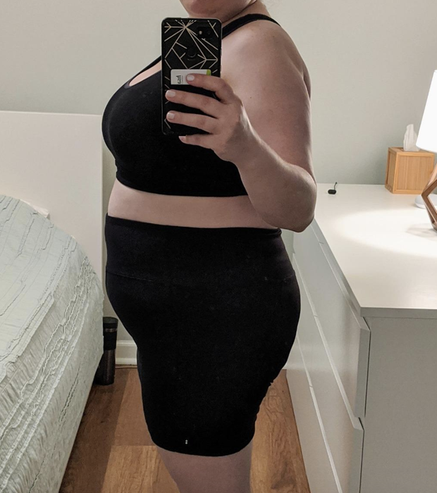 reviewer showcasing the black shorts