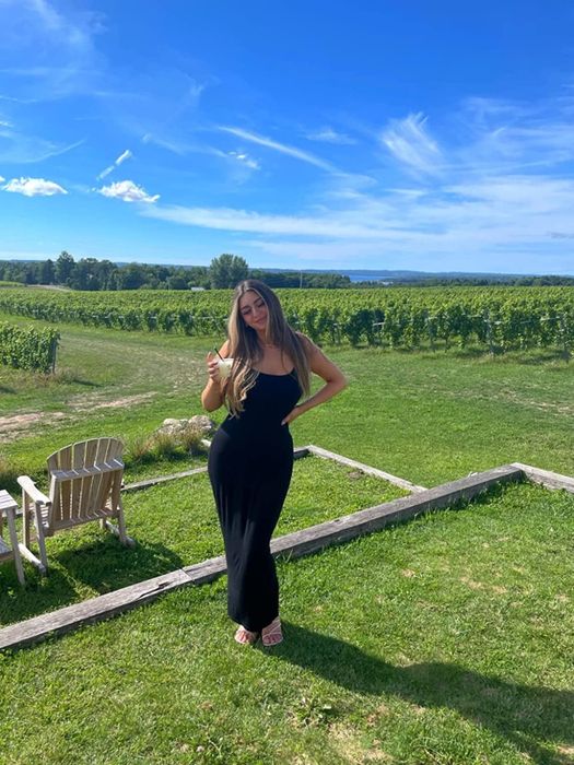 A reviewer rocking the body-con maxi dress in black.