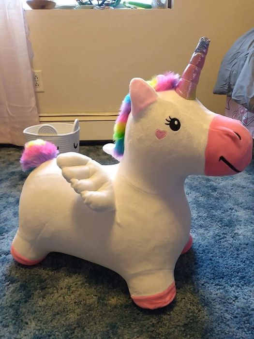A photo of the fluffy inflatable unicorn in use