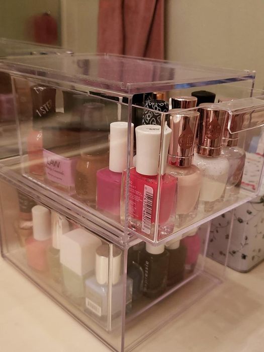 The boxes neatly organized with an array of nail polishes.
