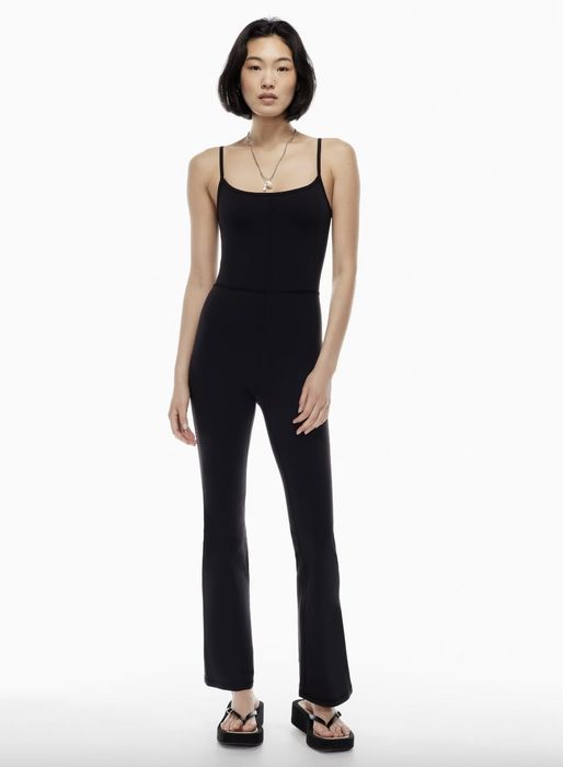 model showcasing the black sleeveless jumpsuit