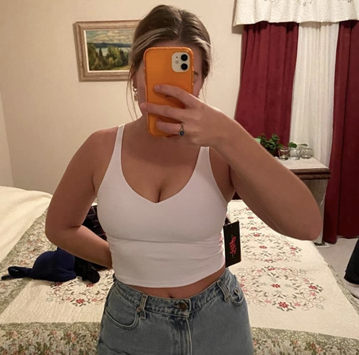 A reviewer showcasing the white top.