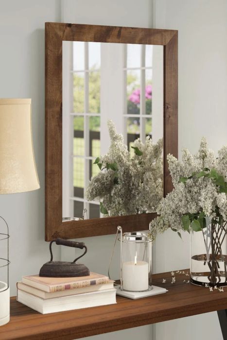 Brown vanity mirror mounted on the wall