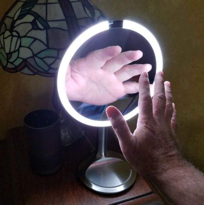 Reviewer photo of hand near the mirror