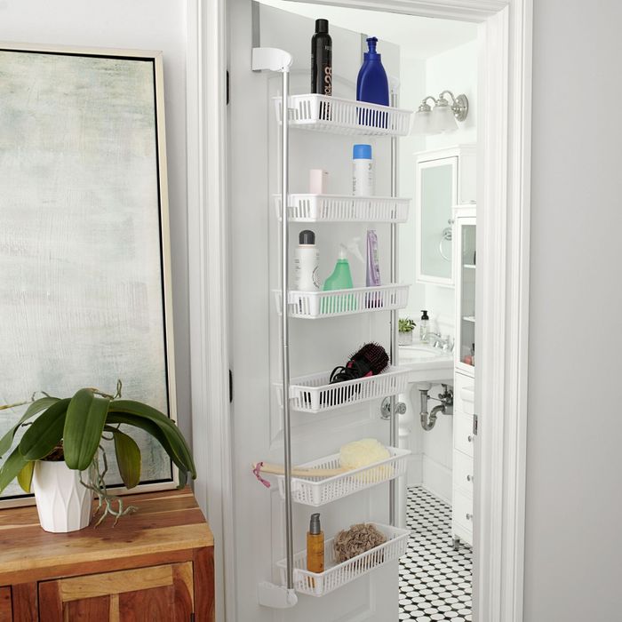 A white over-the-door organizer featuring six baskets to neatly store items.